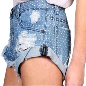 ONE TEASPOON 'Bandit' distressed polka
dot denim shorts. Cutoff and cuffed.